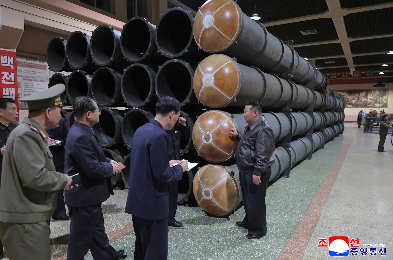 In this undated photo provided on Wednesday, May 7, 2025, by the North Korean government, North Korean leader Kim Jong Un, right, visits a munitions factory in North Korea. Independent journalists were not given access to cover the event depicted in this image distributed by the North Korean government. The content of this image is as provided and cannot be independently verified. Korean language watermark on image as provided by source reads: "KCNA" which is the abbreviation for Korean Central News Agency. (Korean Central News Agency/Korea News Service via AP)