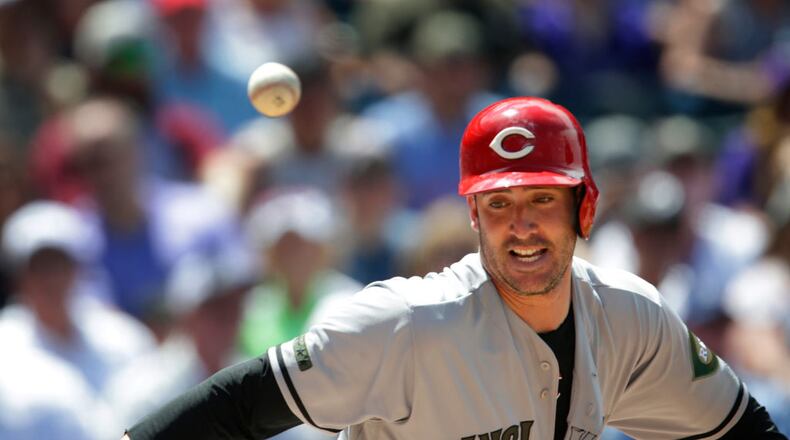 DENVER, CO - MAY 27: Matt Harvey #32 of the Cincinnati Reds dodges the ball as he runs to first base on his ground out in the in the fourth inning against the Colorado Rockies at Coors Field on May 27, 2018 in Denver, Colorado. The Rockies won 8-2. (Photo by Joe Mahoney/Getty Images)