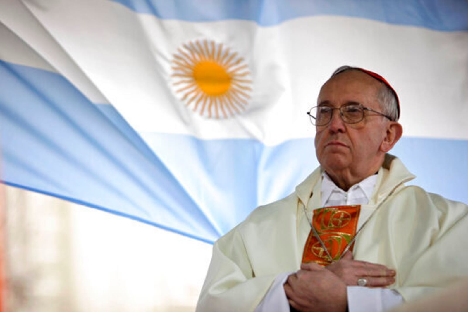 FILE - Argentina's Cardinal Jorge Bergoglio gives a Mass outside the San Cayetano church where an Argentine flag hangs behind in Buenos Aires, Argentina, Friday, Aug. 7, 2009. (AP Photo/Natacha Pisarenko, file)