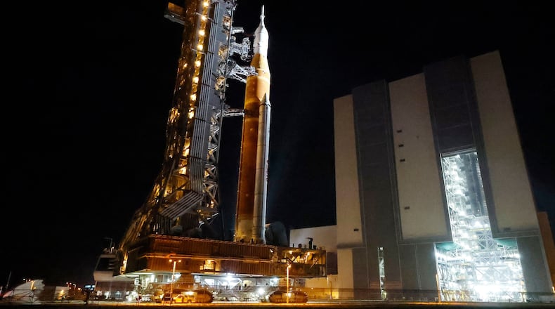 The NASA Artemis II rocket with the Orion spacecraft aboard leaves the Vehicle Assembly Building moving slowly to pad 39B at the Kennedy Space Center in Cape Canaveral, Fla., Friday, March 20, 2026. (AP Photo/Terry Renna)