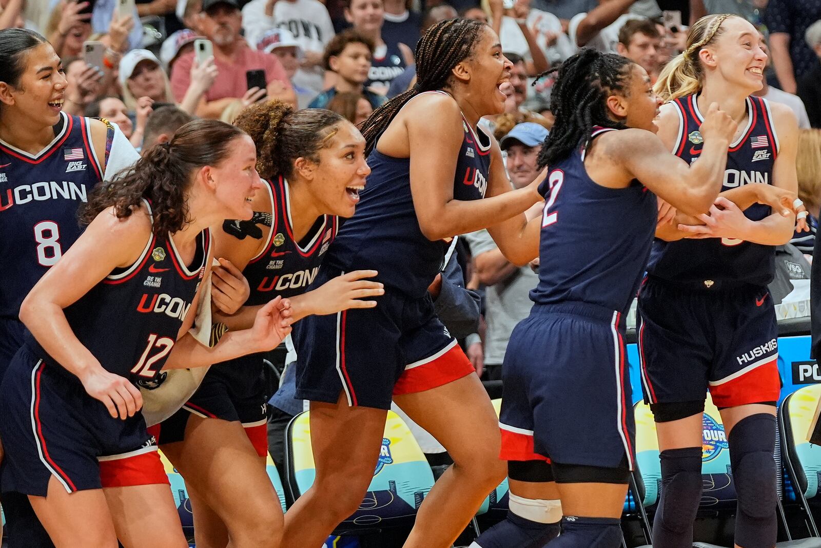 UConn players react late in the second half of the national championship game against South Carolina at the Final Four of the women's NCAA college basketball tournament, Sunday, April 6, 2025, in Tampa, Fla. (AP Photo/John Raoux)