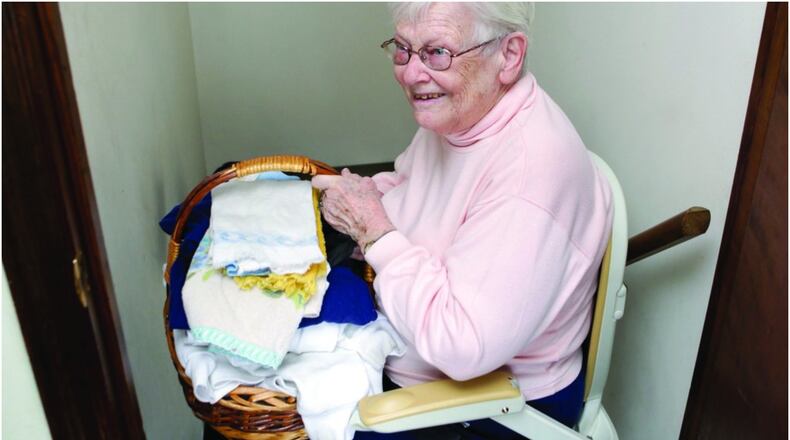 Rosemary Wisecup, a 91 year old Hamilton resident, is able to stay in her because of this chair lift and a walker provided by the Butler County Elderly Services Program. CONTRIBUTED