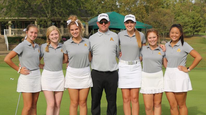 Alter’s girls golf team: Fiona Hoskins (left), Gabbie Houpt, Natalie Bierlein, coach Scott Effinger, Peyton Kuntz, Alex Volk and Maggie Pascual qualified for the Division II state tournament. GREG BILLING PHOTO