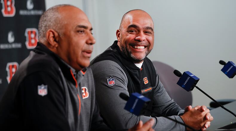 Cincinnati Bengals new NFL football defensive coordinator Teryl Austin, right, smiles alongside head coach Marvin Lewis, left, during a news conference at Paul Brown Stadium, Thursday, Jan. 11, 2018, in Cincinnati. (AP Photo/John Minchillo)