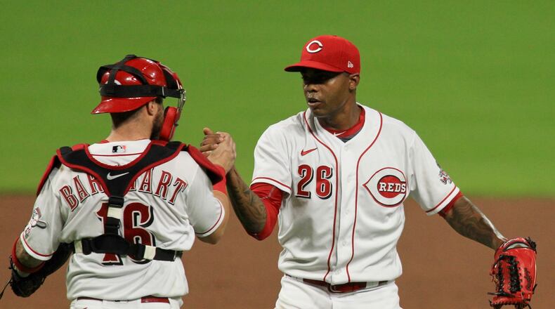 The Reds celebrate a victory against the Indians on Monday, Aug. 3, 2020, at Great American Ball Park in Cincinnati. David Jablonski/Staff