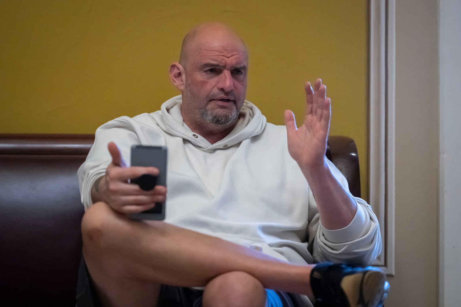 FILE - Sen. John Fetterman, D-Pa., speaks to a reporter near the Senate chamber at the Capitol in Washington, March 14, 2025. (AP Photo/Ben Curtis, File)