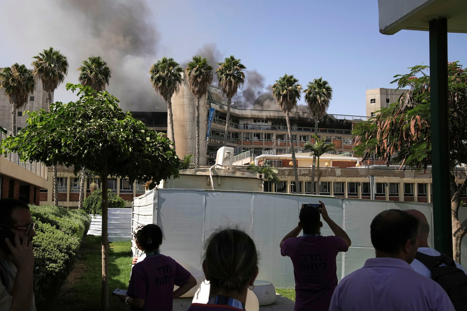 Smokes raises from a building of the Soroka hospital complex after it was hit by a missile fired from Iran in Be'er Sheva, Israel, Thursday, June 19, 2025. (AP Photo/Leo Correa)