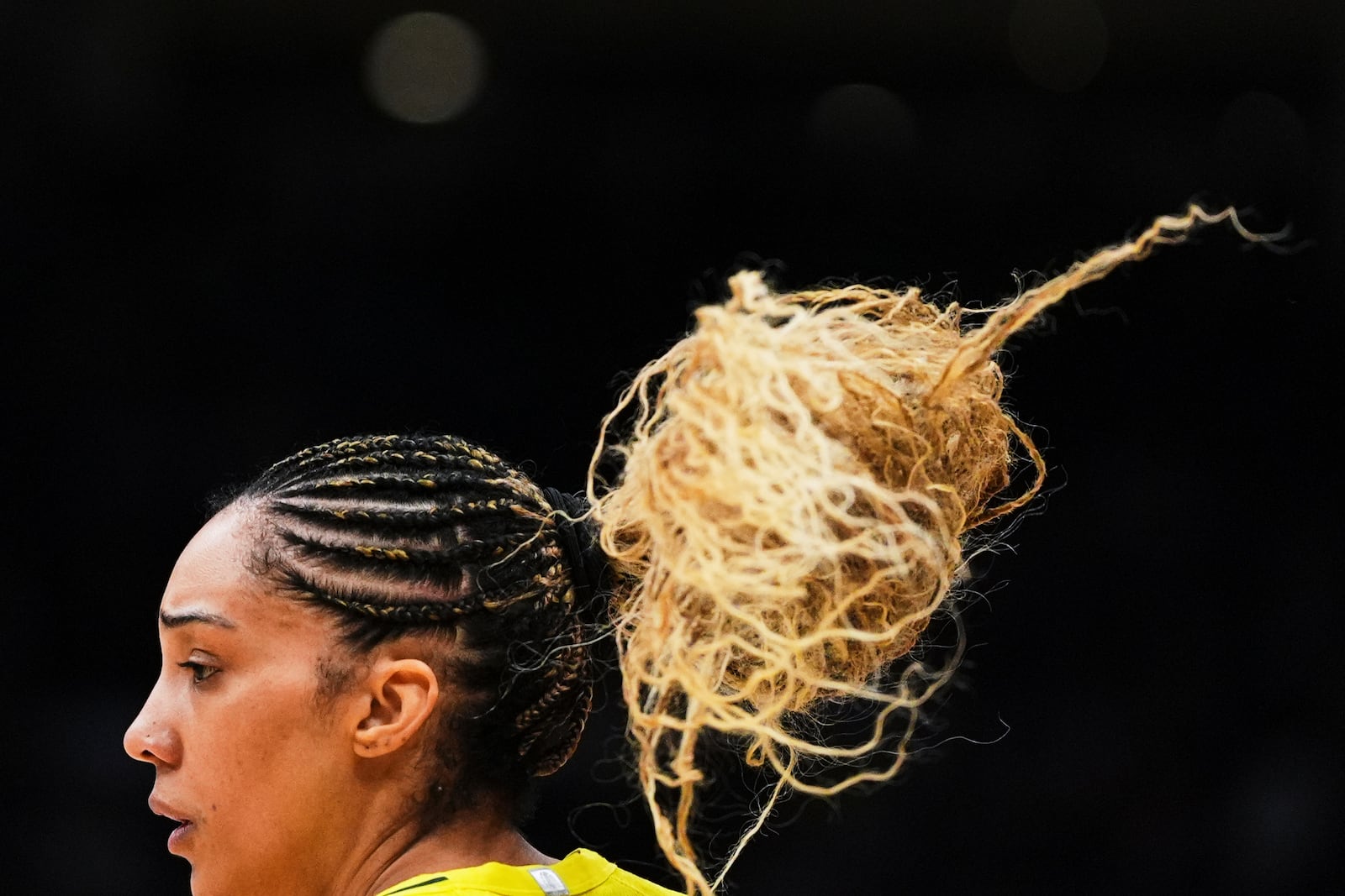 The hair of Seattle Storm forward Gabby Williams bounces as she faces the New York Liberty during the second half of a WNBA basketball game Sunday, June 22, 2025, in Seattle. (AP Photo/Lindsey Wasson)