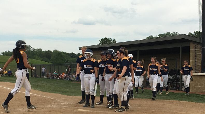 Monroe’s Alexis Arnold is greeted at home plate after hitting a two-run homer in the bottom of the fifth inning Wednesday during a Division II sectional final against Clinton-Massie at Lefferson Park in Middletown. RICK CASSANO/STAFF