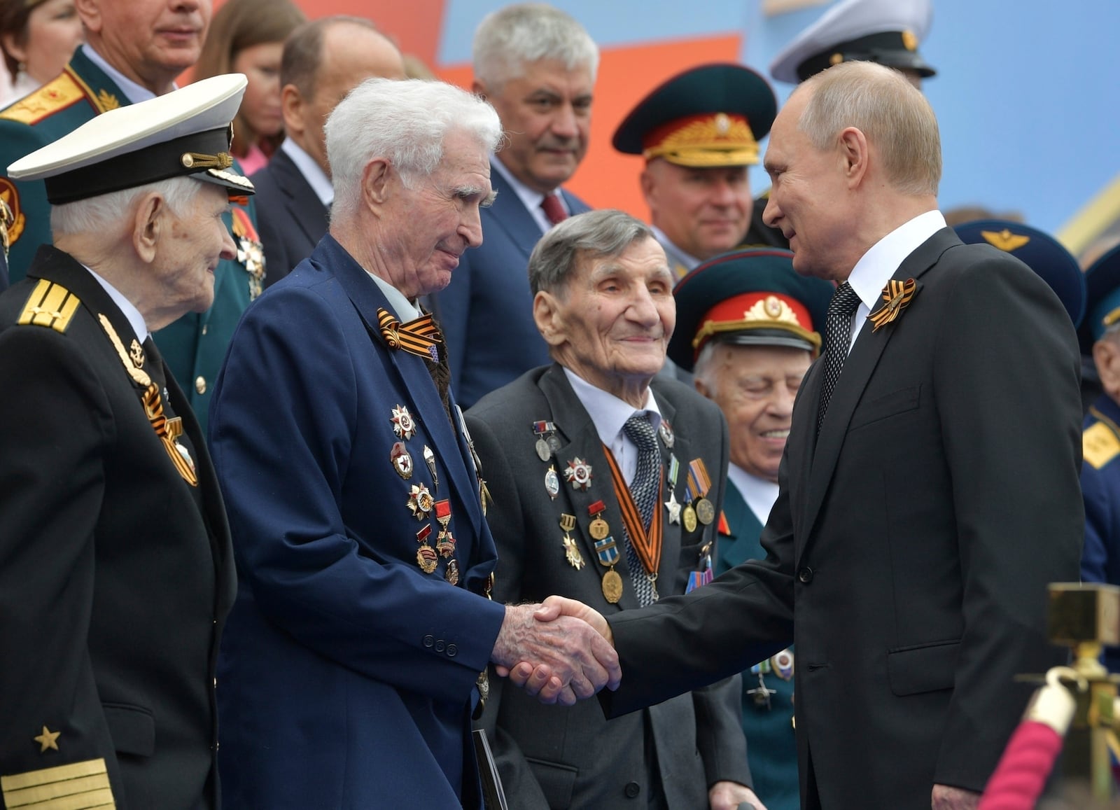 FILE - Russian President Vladimir Putin shakes hands with World War II veterans prior to a Victory Day parade in Red Square in Moscow on May 9, 2019. (Alexei Druzhinin, Sputnik, Kremlin Pool Photo via AP, File)