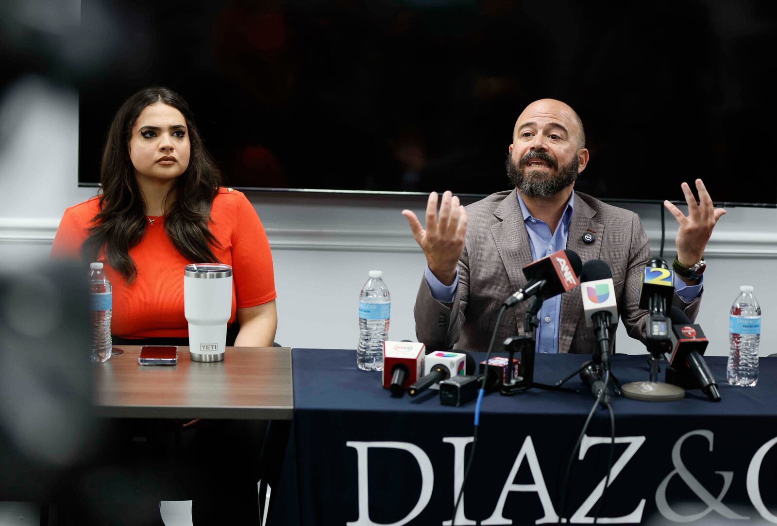 Giovanni Diaz, alongside Katherine Guevara, speaks during a press conference about the status of Mario Guevara, a metro Atlanta-based Spanish-language reporter from MGNews, addressing his situation following his arrest while covering an immigration rally, Tuesday, June 17, 2025, in Smyrna, Ga. (Miguel Martinez/Atlanta Journal-Constitution via AP)