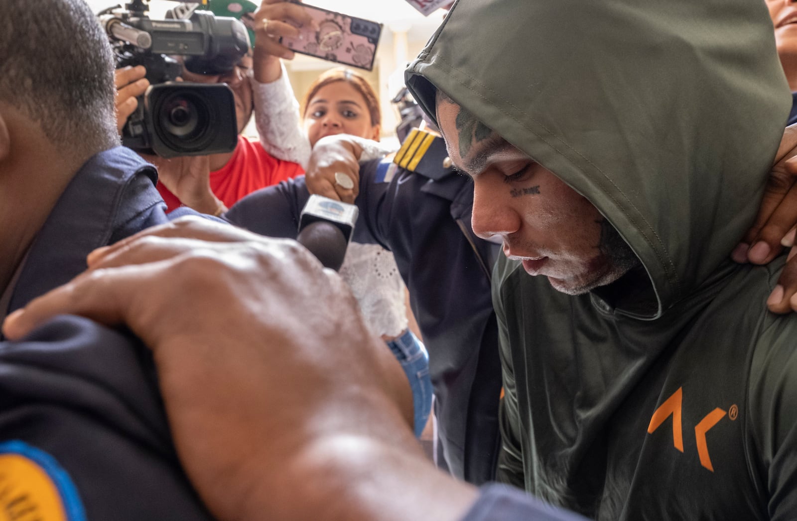 FILE - Rapper Daniel Hernandez, known as Tekashi 6ix9ine, is escorted by police at the Palace of Justice, in Santo Domingo, Dominican Republic, Jan. 20, 2024. (AP Photo/Ricardo Hernández, file)