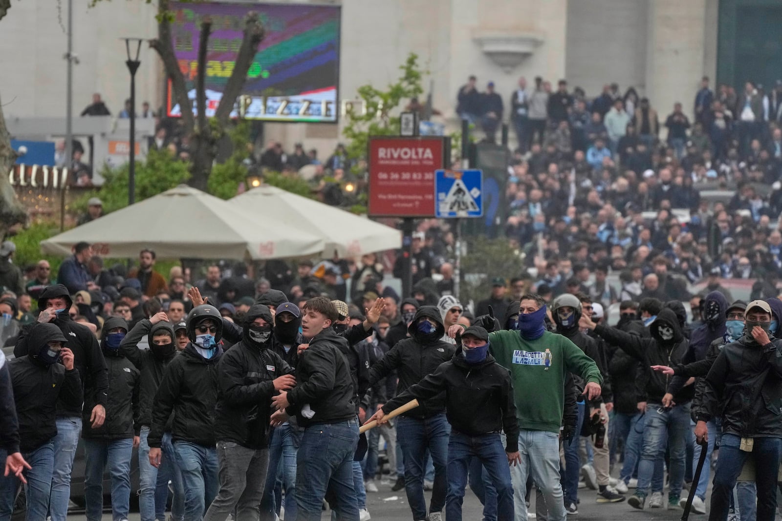 Lazio fans riot with police ahead of the Italian Serie A soccer match between Lazio and Roma at Rome's Olympic stadium, Sunday, April 13, 2025. (AP Photo/Gregorio Borgia)