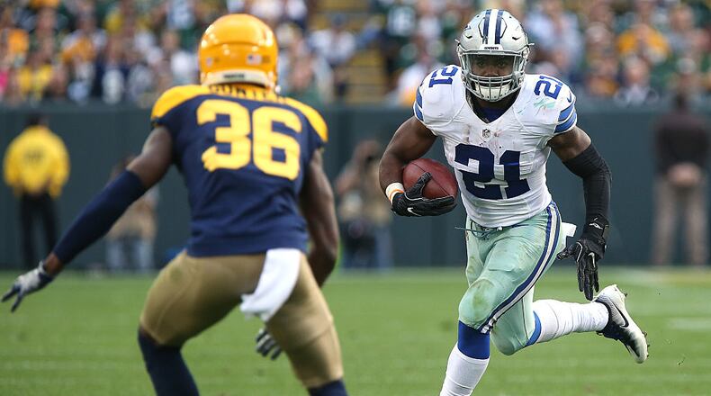 GREEN BAY, WI - OCTOBER 16: Ezekiel Elliott #21 of the Dallas Cowboys looks to avoid the tackle from LaDarius Gunter #36 of the Green Bay Packers during the second quarter at Lambeau Field on October 16, 2016 in Green Bay, Wisconsin. (Photo by Dylan Buell/Getty Images)