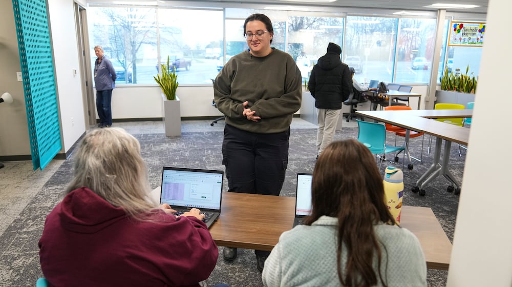 Taylor Desert, a TSA agent, checks in to pick up groceries at Gleaners Food Bank in Indianapolis, Monday, March 23, 2026. (AP Photo/Michael Conroy)