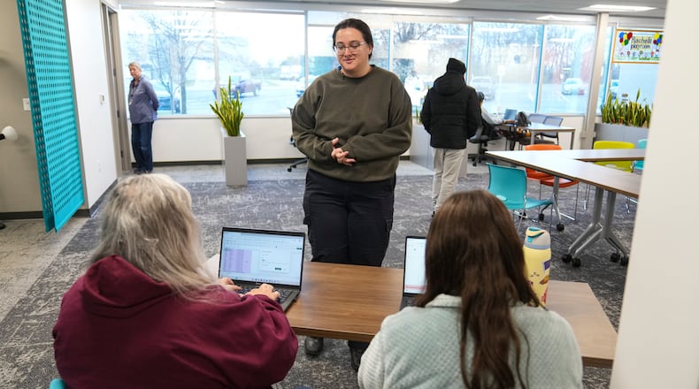 Taylor Desert, a TSA agent, checks in to pick up groceries at Gleaners Food Bank in Indianapolis, Monday, March 23, 2026. (AP Photo/Michael Conroy)