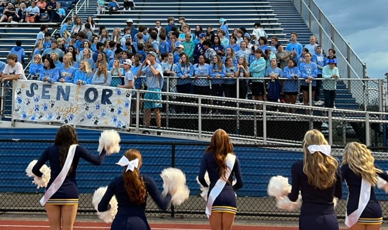 Monroe High School's student section sports Carolina blue in support of Ross student Kenley Commins, who has been battling lymphoma. CONTRIBUTED