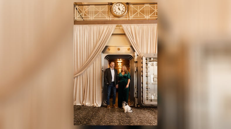 Mica Glaser Jones, right, and her husband Theron, along with their dog Oliver Banks, are seen inside The Windamere in Middletown. Glaser Jones said the dog is the venue mascot. CHRISTINA JANE PHOTOGRAPHY/CONTRIBUTED