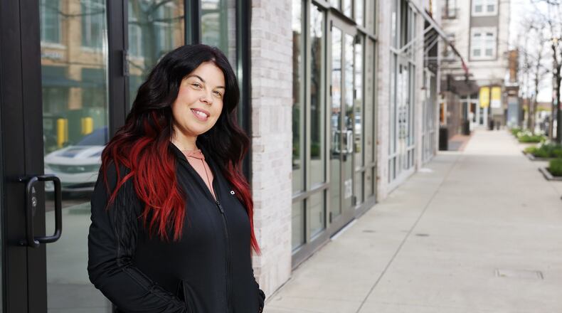 Melissa Portillo stands in front of the storefront where her restaurant, Sandwich Cafe and Deli, will be located at Liberty Center. NICK GRAHAM / STAFF