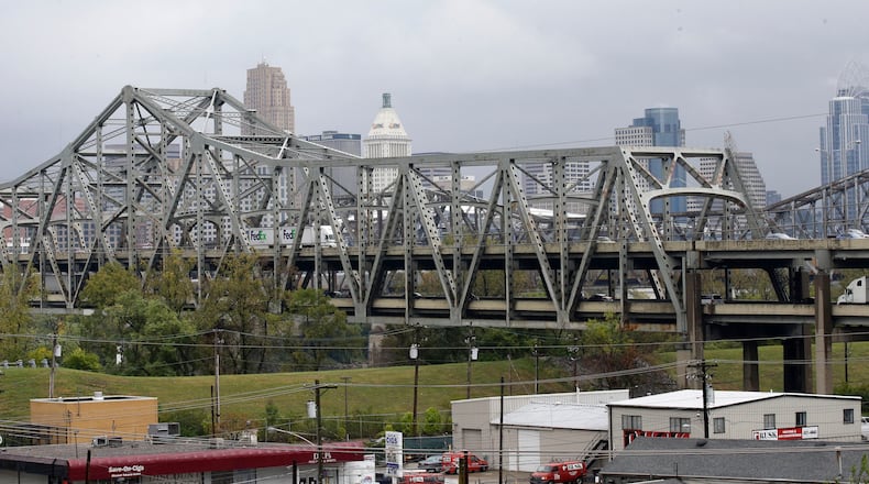 FILE - Traffic on the Brent Spence Bridge passes in front of the Cincinnati skyline while crossing the Ohio River to and from Covington, Ky., Oct. 7, 2014. (AP Photo/Al Behrman, File)