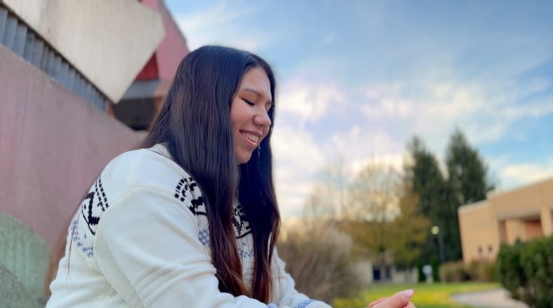 Mia Diaz moved to America last year to try to become a lawyer. The 19-year-old says it's been difficult, but rewarding for the education she's receiving at Miami University's Hamilton campus. KEITH BIERYGOLICK/WCPO