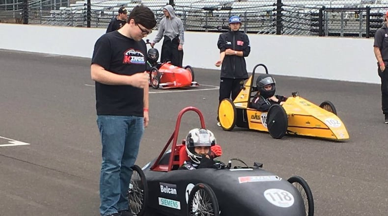 Kings High School students Hunter Blair and Tyler Lewis (in car) were part of the school’s team at the Greenpower Electric Car Challenge held at the Indianapolis Motor Speedway on April 30-May 1. Teams of students from across the country learned to design and build single-seat, student-drive electric cars as part of the challenge. CONTRIBUTED