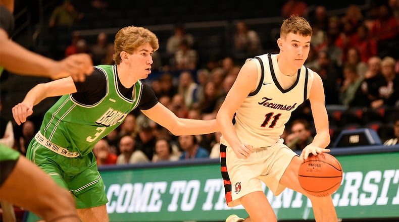 Tecumseh High School senior Corey Russell is guarded by Badin senior Cody Knapp during their Division III district final game on Saturday, March 7, 2026 at the University of Dayton Arena. GEOFF NEVILLE / CONTRIBUTED PHOTO