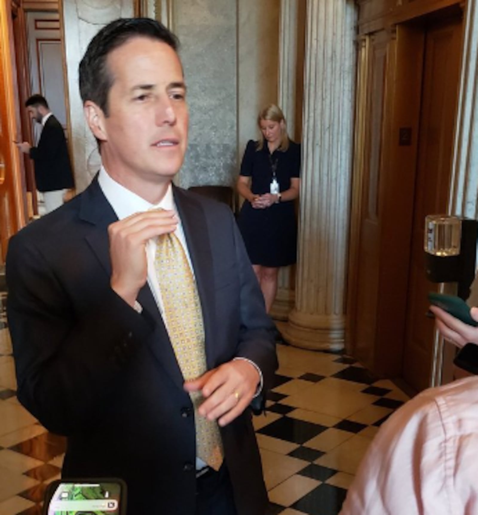 Ohio's U.S. Sen. Bernie Moreno talks to reporters in the halls of Congress in August 2025. Photo credit Jamie Dupree.