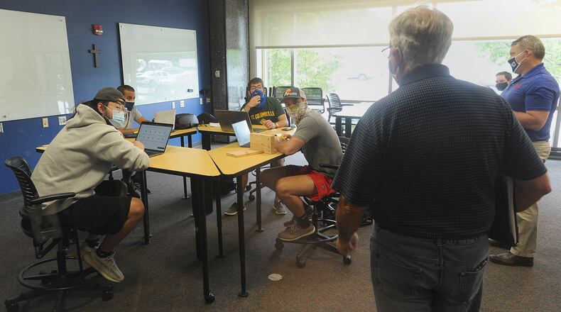 Some University of Dayton students saw their instructors face-to-face Wednesday as the university begins its first day of in-person classes for select courses. MARSHALL GORBY/STAFF