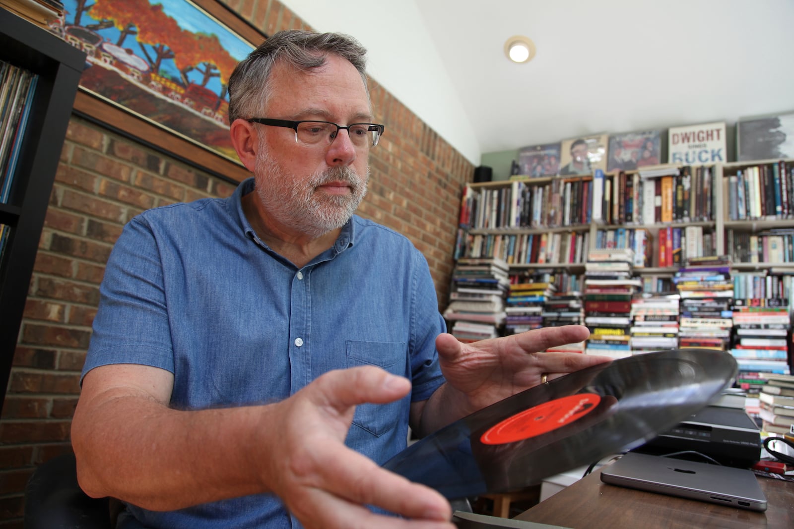 Music historian and journalist Brian Mansfield holds an original pressing of the "Buckingham Nicks" vinyl record at his home in Nashville, Tenn., Wednesday, July 23, 2025. (AP Photo/Kristin M. Hall)