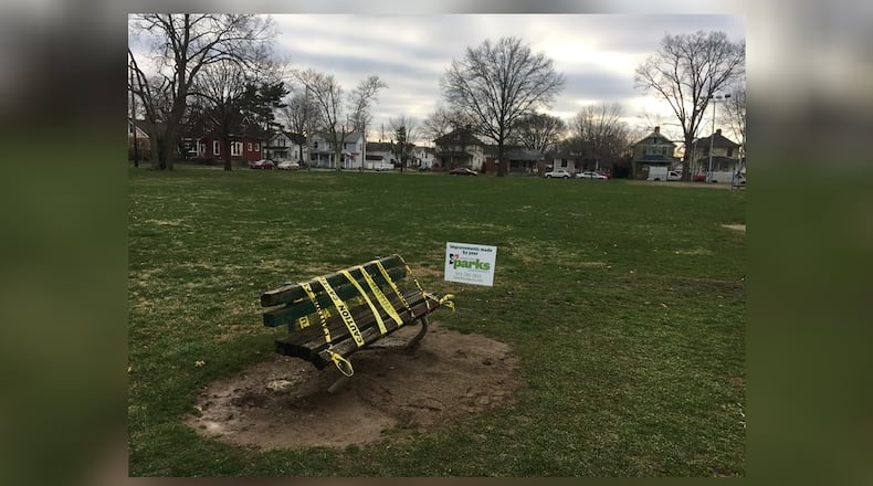 Caution tape covers a bench in Lindenwald Park, where police investigated the report of a dead body on April 2.
