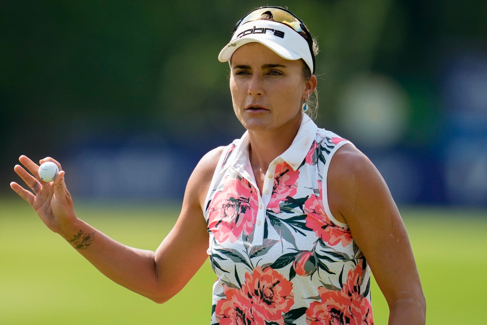 Lexi Thompson walks off the 17th green during the third round of the Chevron Championship LPGA golf tournament Saturday, April 26, 2025, in The Woodlands, Texas. (AP Photo/Ashley Landis)