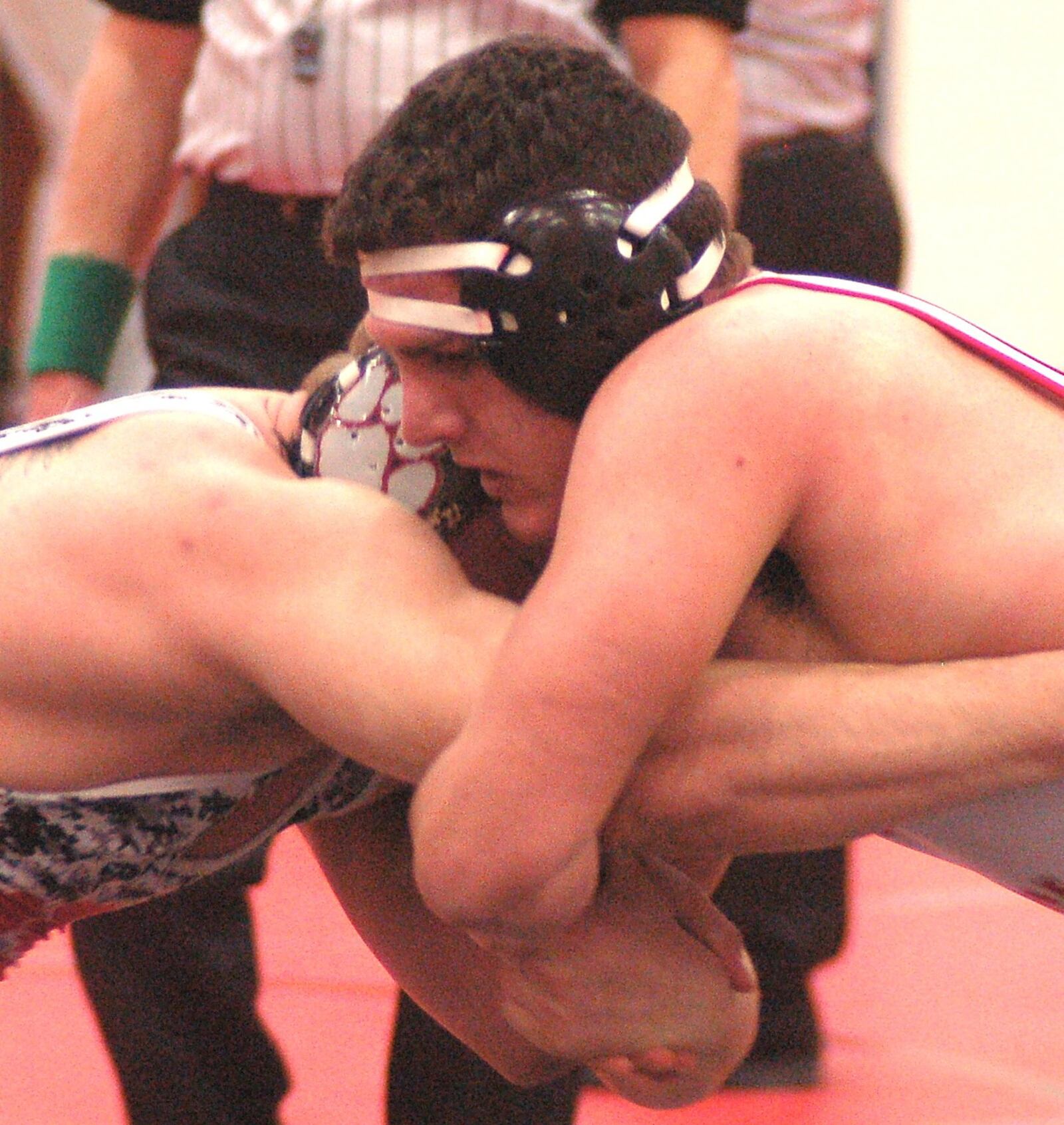 Carlisle’s Reece Human (right) battles Franklin’s Wyatt Hillard for position during their 220-pound title match at the Southwestern Buckeye League tournament Saturday at Madison. Human won his third title with a 3-0 decision. CONTRIBUTED PHOTO BY JOHN CUMMINGS