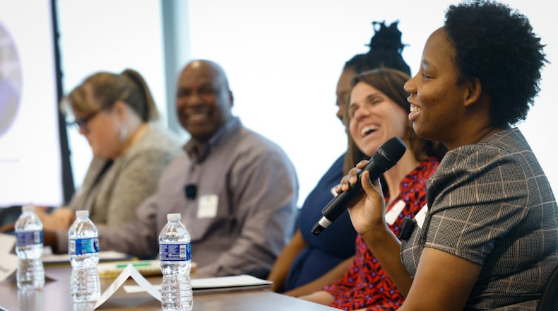 Home Visitor Service Coordinator Takeia Ely, right, talks during the Groundwork Ohio listening tour held at Dayton Hospital Tech Town Thursday June 6, 2024. JIM NOELKER/STAFF