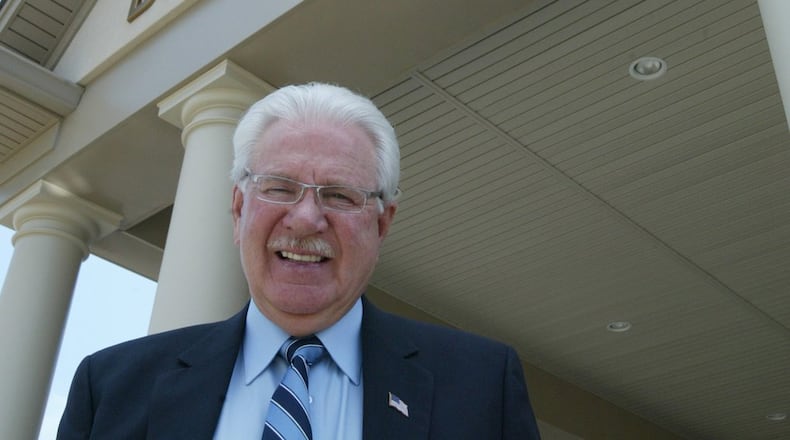 Carlos Todd, shown on the steps of the the-new GOP headquarters in 2006, at the end of his tenure as the executive chairman of the Butler County Republican Party.