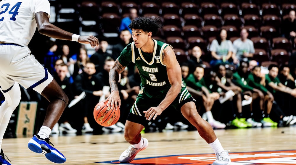 South Florida's Wes Enis, a Miami East graduate, dribbles against George Washington on Nov. 3, 2025, at the Yuengling Center in Tampa, Fla. Photo courtesy of South Florida