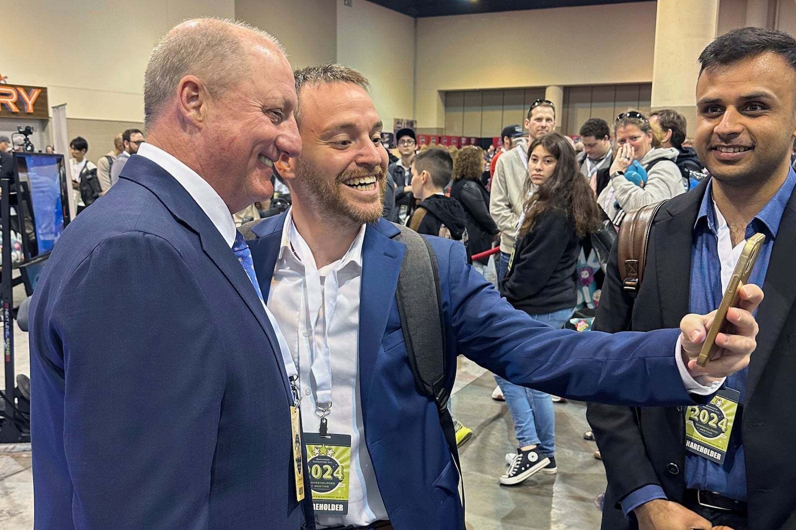 FILE - Berkshire Hathaway shareholders line up to take selfies with Greg Abel Friday, May 3, 2024, in Omaha, Neb. (AP Photo/Josh Funk, File)