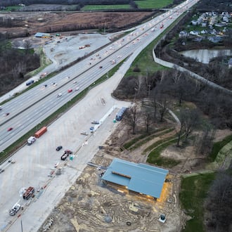 Two new rest stops are taking shape along north and southbound I-75 in Butler County, just south of the SR 63 and I-75 interchange in Monroe. State transportation officials say the two rest areas now under construction are scheduled to open in late summer and will feature more truck parking. Aerial photo view is looking south along I-75. (Photo By Nick Graham/ Journal-News)