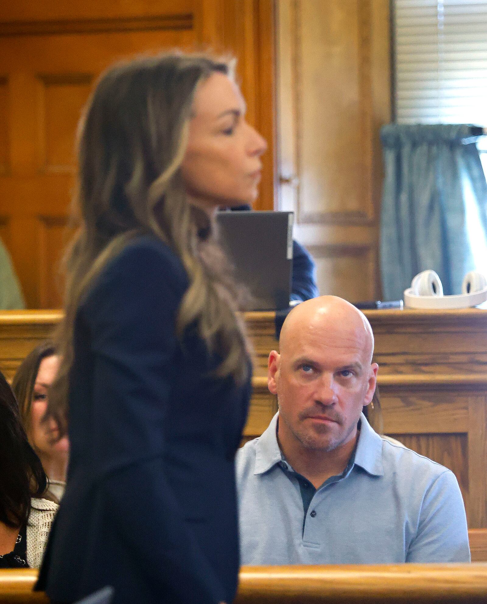 John O'Keefe's brother Paul watches Karen Read head to a sidebar conference with the judge and her defense team during her trial in Norfolk Superior Court at Dedham, Mass., on Wednesday, April 23, 2025 (Greg Derr/The Patriot Ledger via AP, Pool)