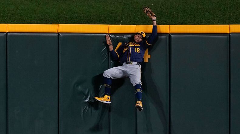 Milwaukee Brewers center fielder Blake Perkins catches a ball hit by Cincinnati Reds' Noelvi Marte during the sixth inning of a baseball game, Saturday, Aug. 31, 2024, in Cincinnati. (AP Photo/Carolyn Kaster)