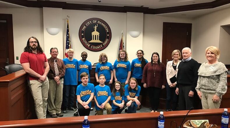 Students from Hamilton Schools’ Brookwood Elementary recently presented their Lego engineering project to city and county officials in the city council chambers. The 5th and 6th graders, who designed a plan to better alert drivers in the Butler County city when a train may be traveling through downtown, impressed the officials who praised their work. (Provided Photo/Journal-News)