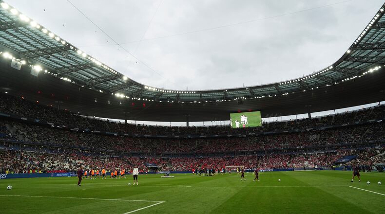 FILE - Players of Paris Saint-Germain and Reims warm up prior to the French Cup soccer final at the Stade de France stadium in Saint-Denis, outside Paris, Saturday May 24, 2025. (AP Photo/Aurelien Morissard, file)