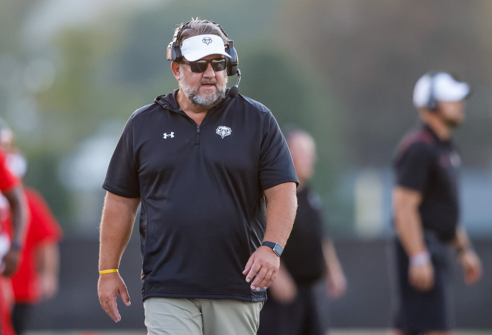 Lakota West head coach Tom Bolden walks the sideline during their football game against Hamilton Friday, Sept. 17, 2021 at Virgil M. Schwarm Stadium at Hamilton High School. Lakota West won 49-13. NICK GRAHAM / STAFF