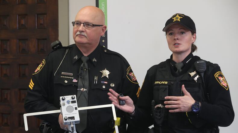 Clark County Sheriff's Sgt. Ralph Underwood and Deputy Jolene Irons talk about the the new Project Lifesaver that the Sheriff's office is being trained on this week to track individuals with cognitive problems, such as alzheimer's disease, if they get lost. BILL LACKEY/STAFF