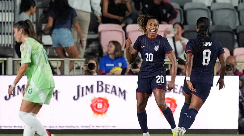 United States forward Catarina Macario (20) celebrates after scoring her side's first goal against Italy during the first half of an international friendly soccer match, Monday, Dec. 1, 2025, in Fort Lauderdale, Fla. (AP Photo/Rebecca Blackwell)
