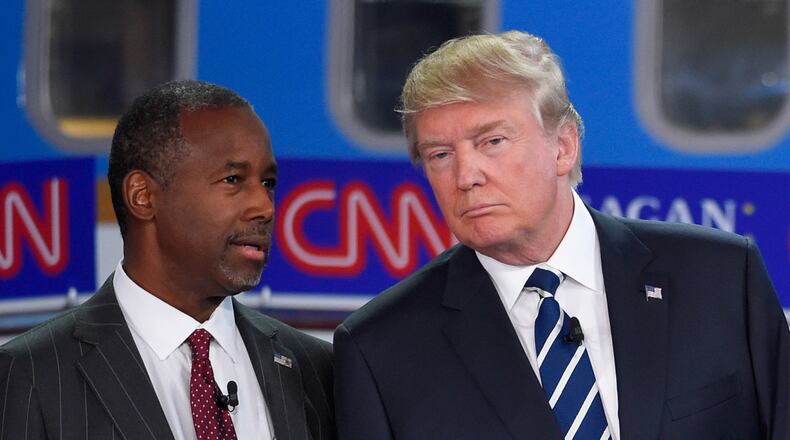 Republican presidential candidates Ben Carson, left, and Donald Trump talk before the start of the CNN Republican presidential debate at the Ronald Reagan Presidential Library and Museum on Wednesday, Sept. 16, 2015, in Simi Valley, Calif. (AP Photo/Mark J. Terrill)