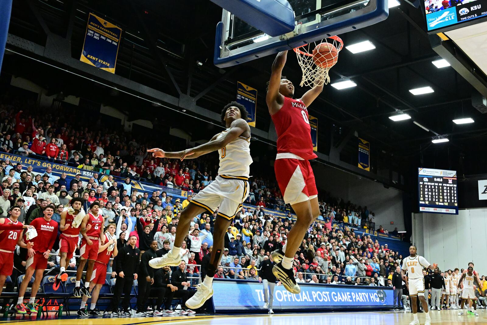 Miami forward Eian Elmer dunks against Kent State forward Rayvon Griffith during overtime of an NCAA college basketball game, Tuesday, Jan. 20, 2026, in Kent, Ohio. (AP Photo/David Dermer)