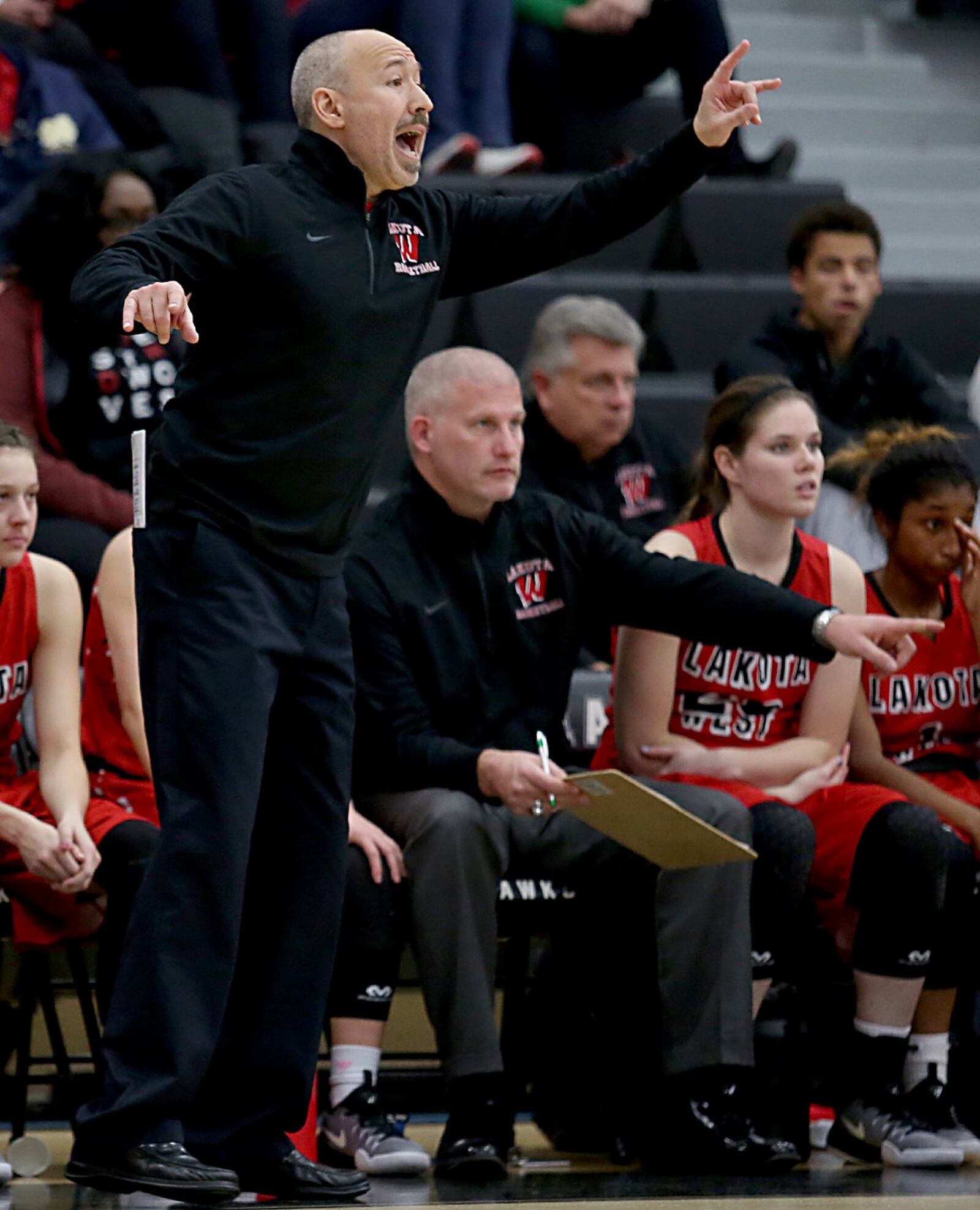 Lakota West coach Andy Fishman directs his team during Wednesday night’s game at Lakota East. CONTRIBUTED PHOTO BY E.L. HUBBARD