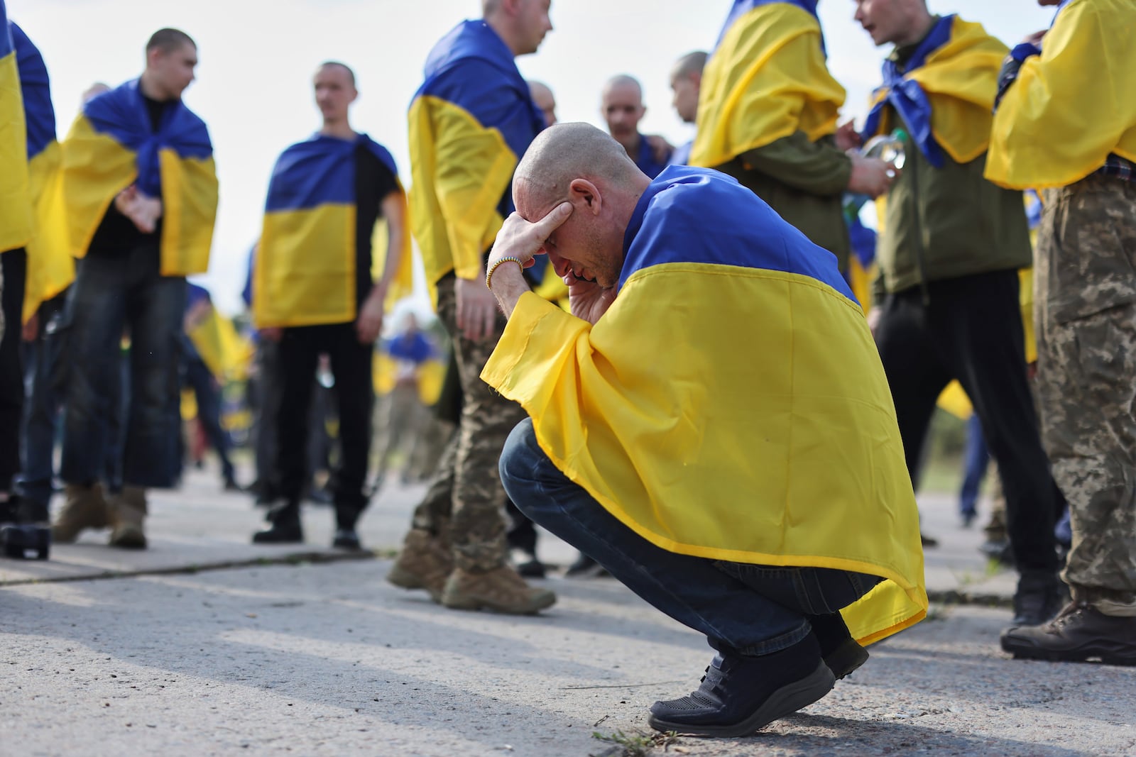 A Ukrainian soldier reacts after returning from captivity following an exchange between Russia and Ukraine, in Chernyhiv region, Ukraine, Friday, May 23, 2025. (AP Photo)