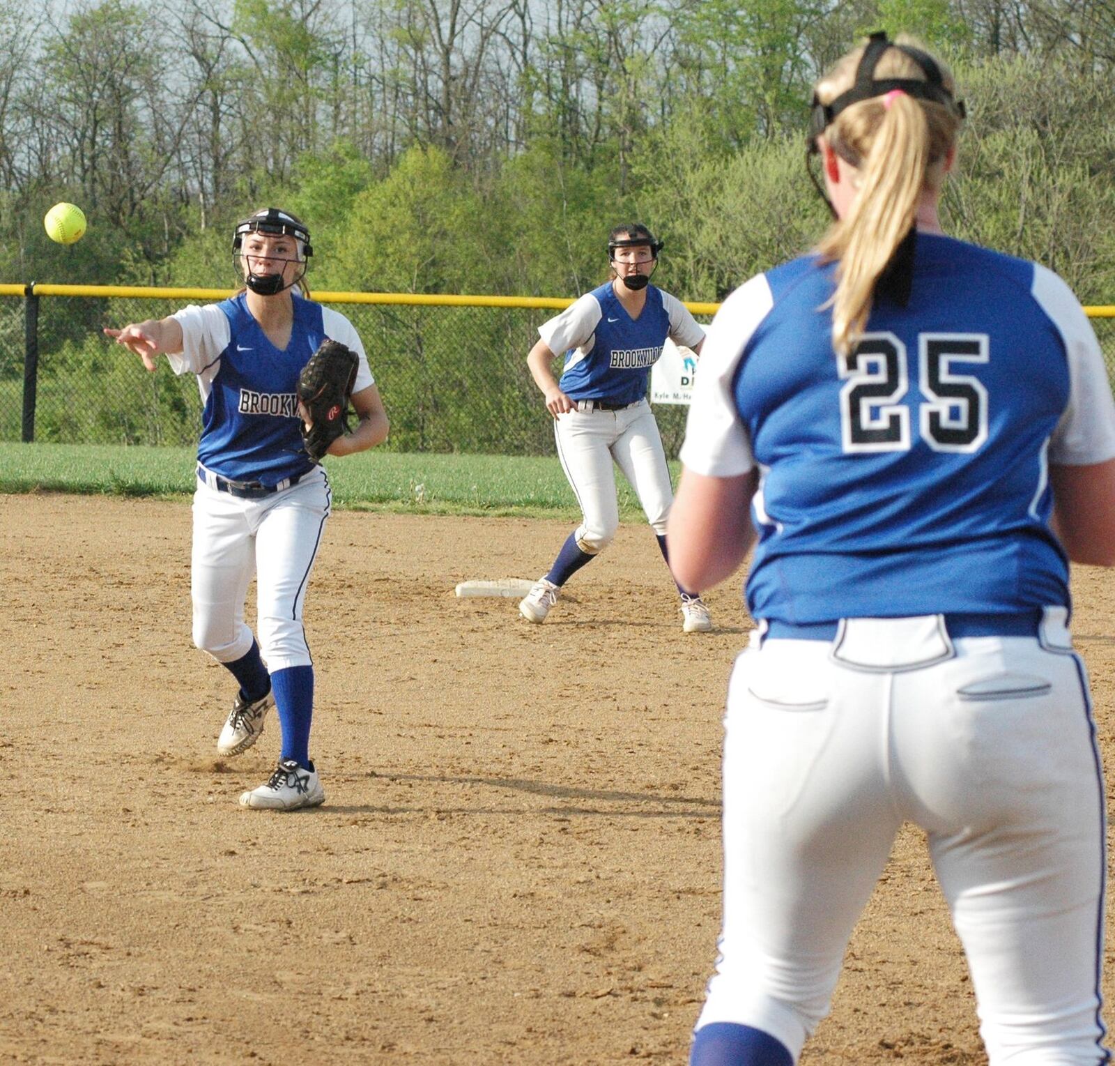 Brookville second baseman Ashley Lenser throws to first baseman Jessica Brown for an out Tuesday during a Southwestern Buckeye League Southwestern Division softball game at Monroe. The host Hornets won 1-0. RICK CASSANO/STAFF